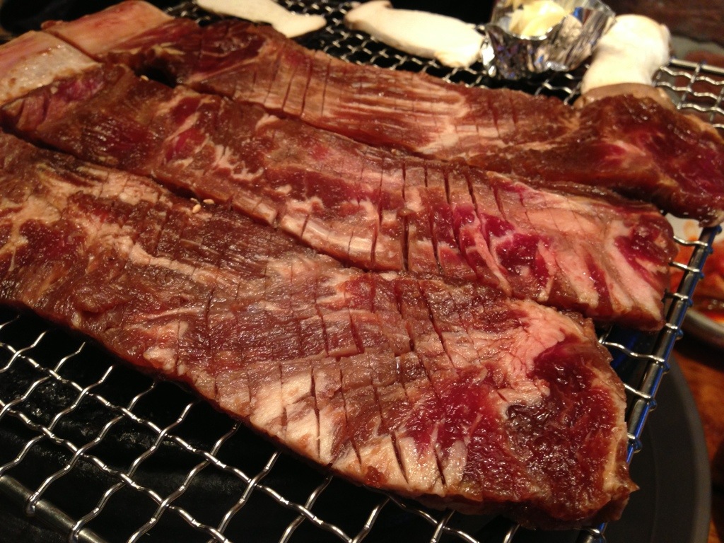 using the scissors to cut up the beef.